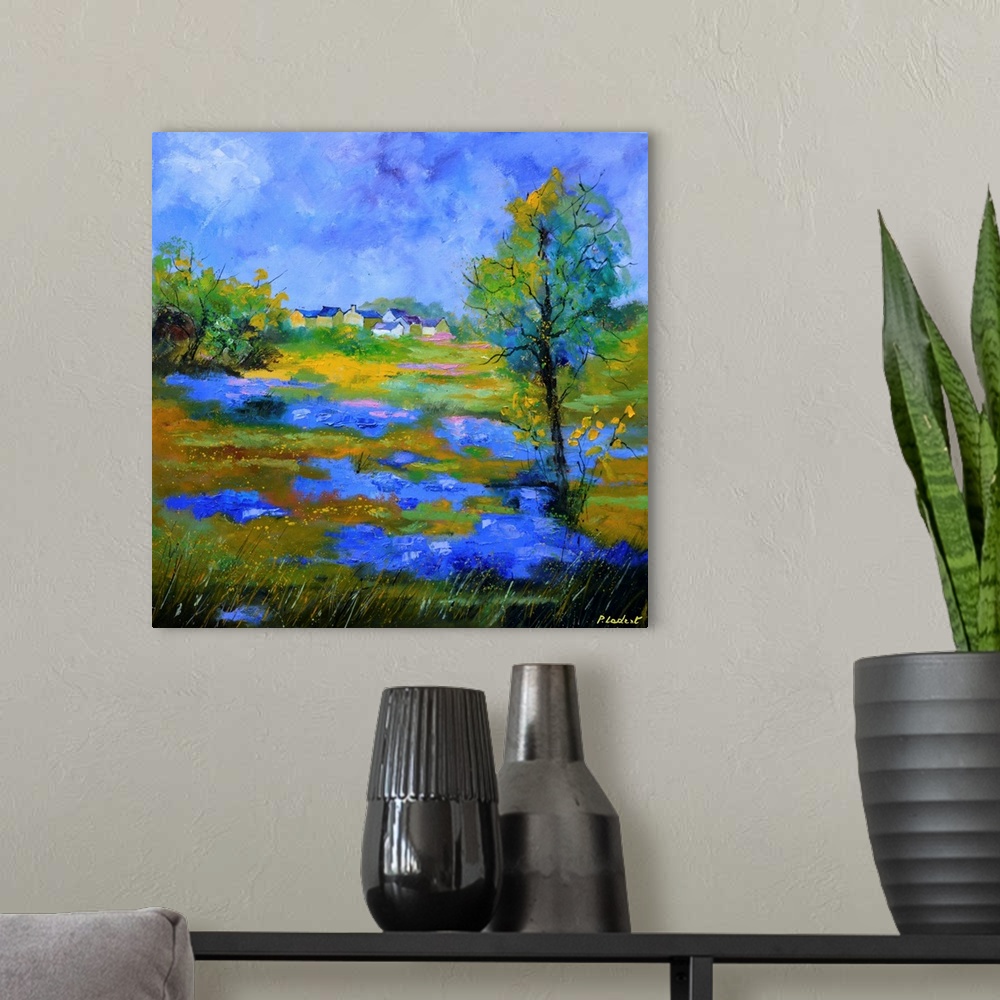 A modern room featuring Contemporary landscape painting of a field of blue cornflowers.