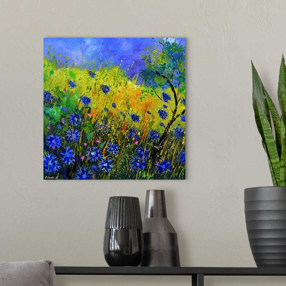 A modern room featuring Contemporary landscape painting of a field of blue cornflowers.