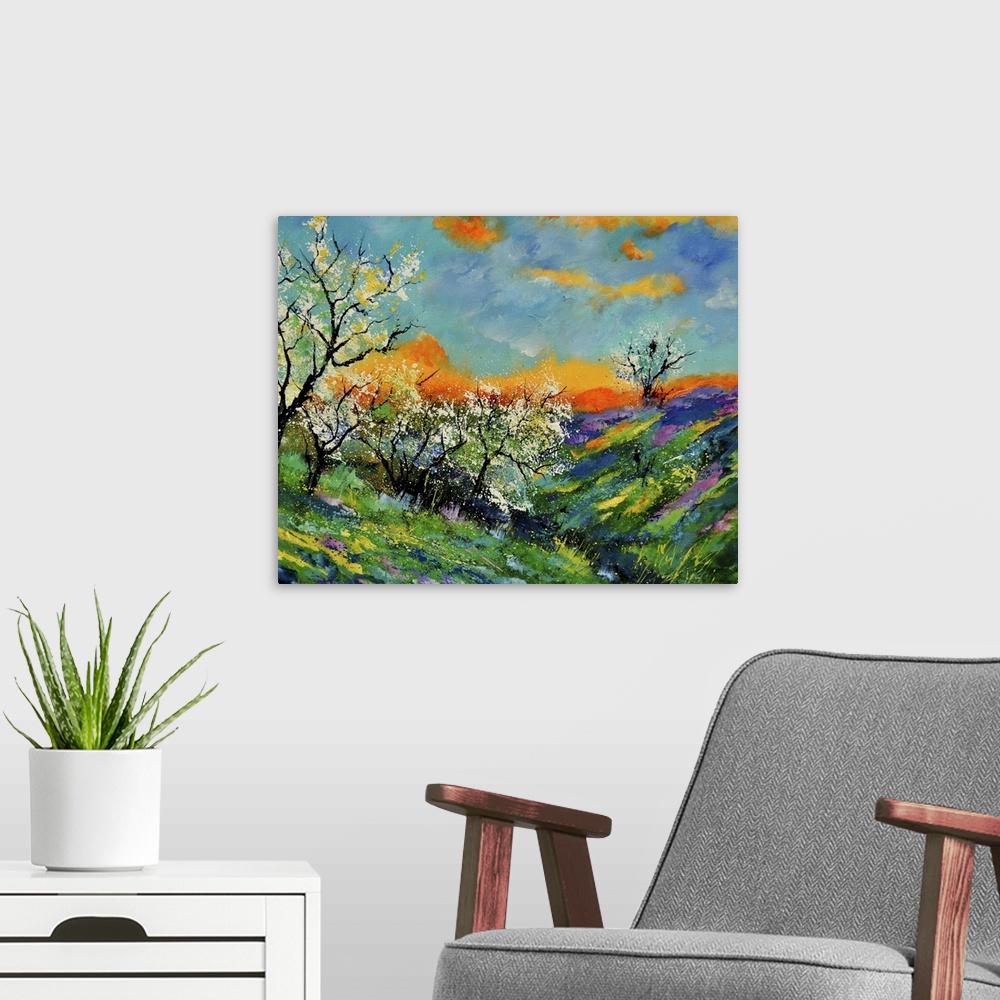 A modern room featuring Vibrant colored springtime scene of a field of blooming flowers and trees with a bright orange/bl...