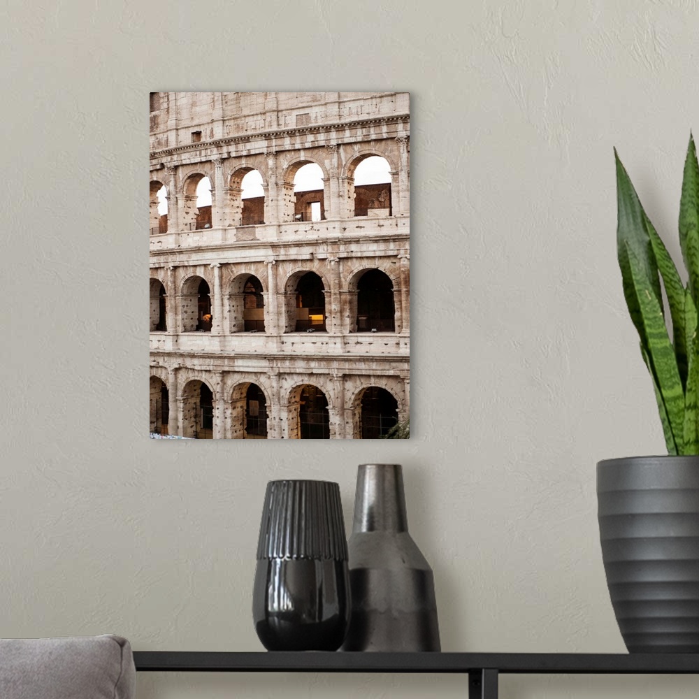 A modern room featuring Detailed photograph of the Colosseum walls in Rome.