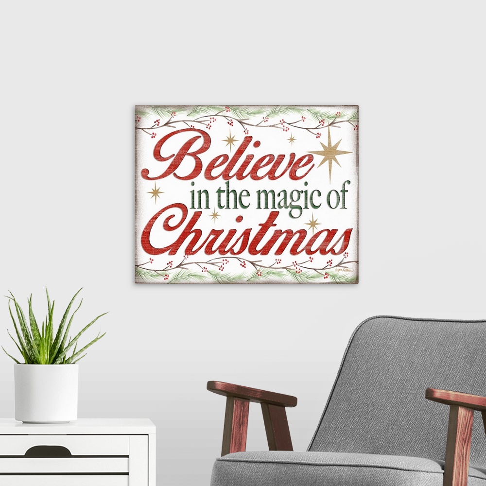A modern room featuring "Believe In The Magic Of Christmas" in red and green bordered by holly branches and surrounded by...
