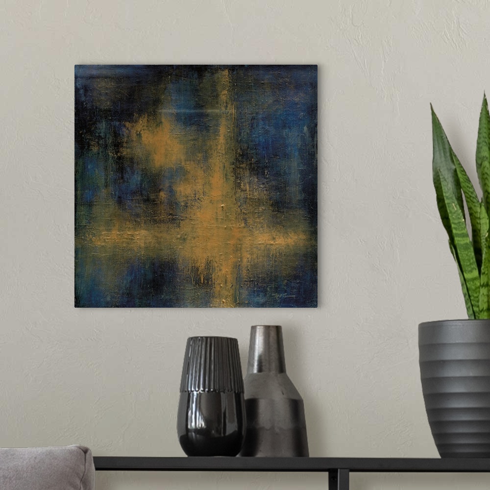 A modern room featuring A square abstract painting of yellow, black and blue in a cross shape.