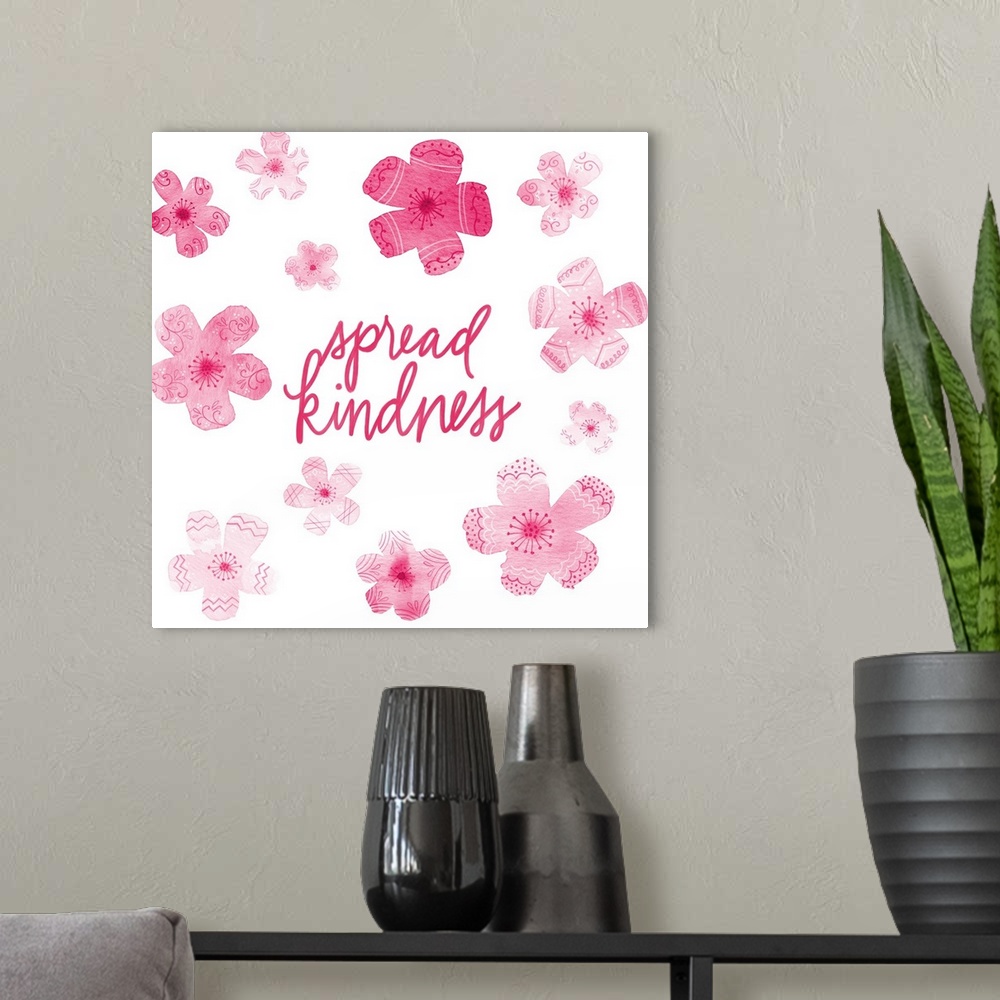 A modern room featuring "Spread Kindness" with pink flowers with different patterns on a white background.
