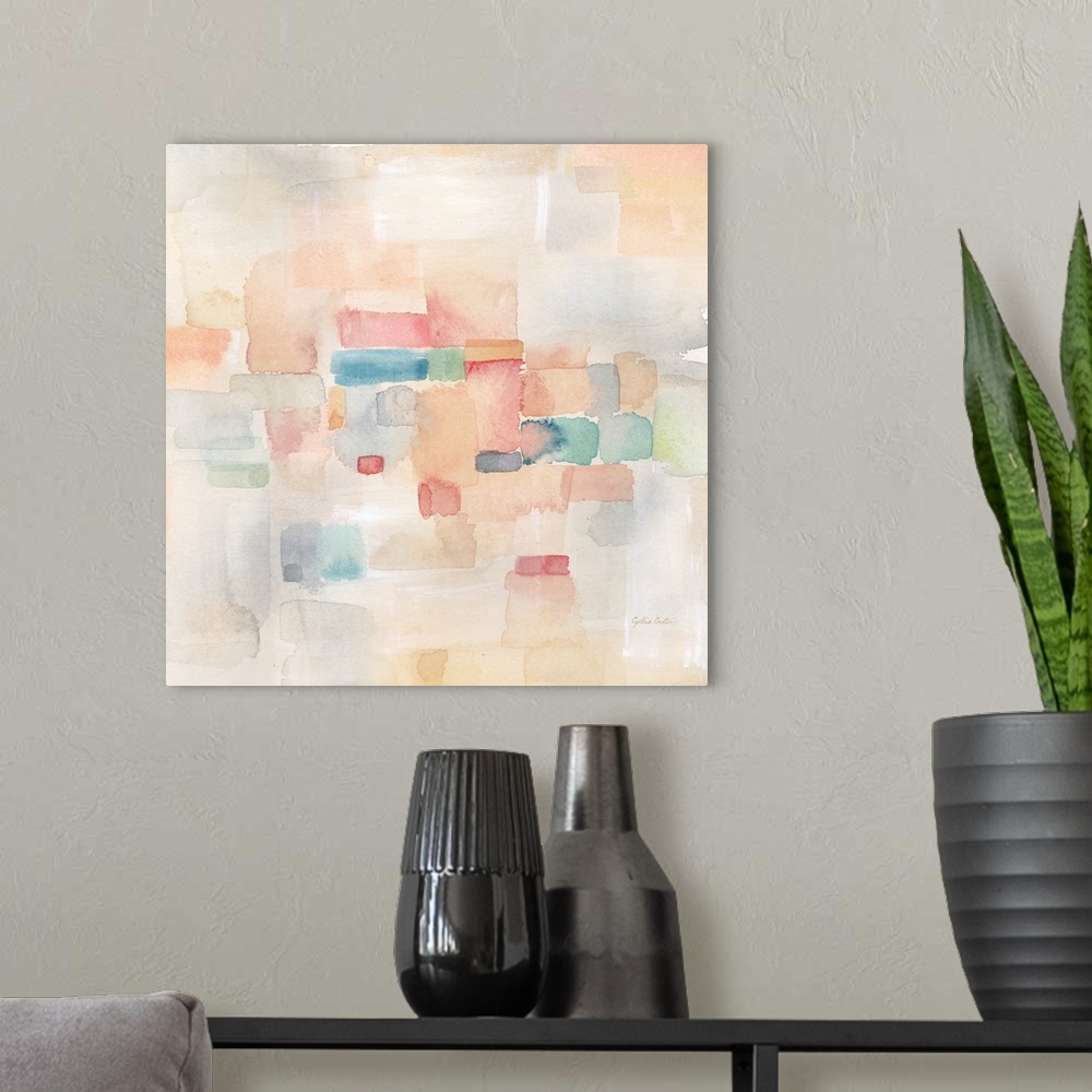 A modern room featuring Square abstract watercolor painting in blurred square shapes in muted tones of pink, blue and green.