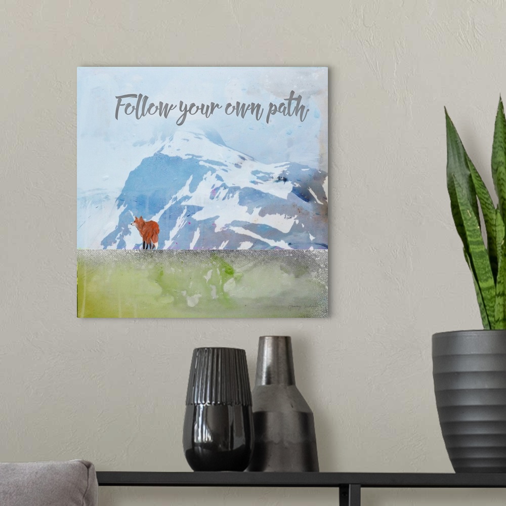 A modern room featuring "Follow Your Own Path" in gray with a red fox standing before blue mountains and sky with a weath...