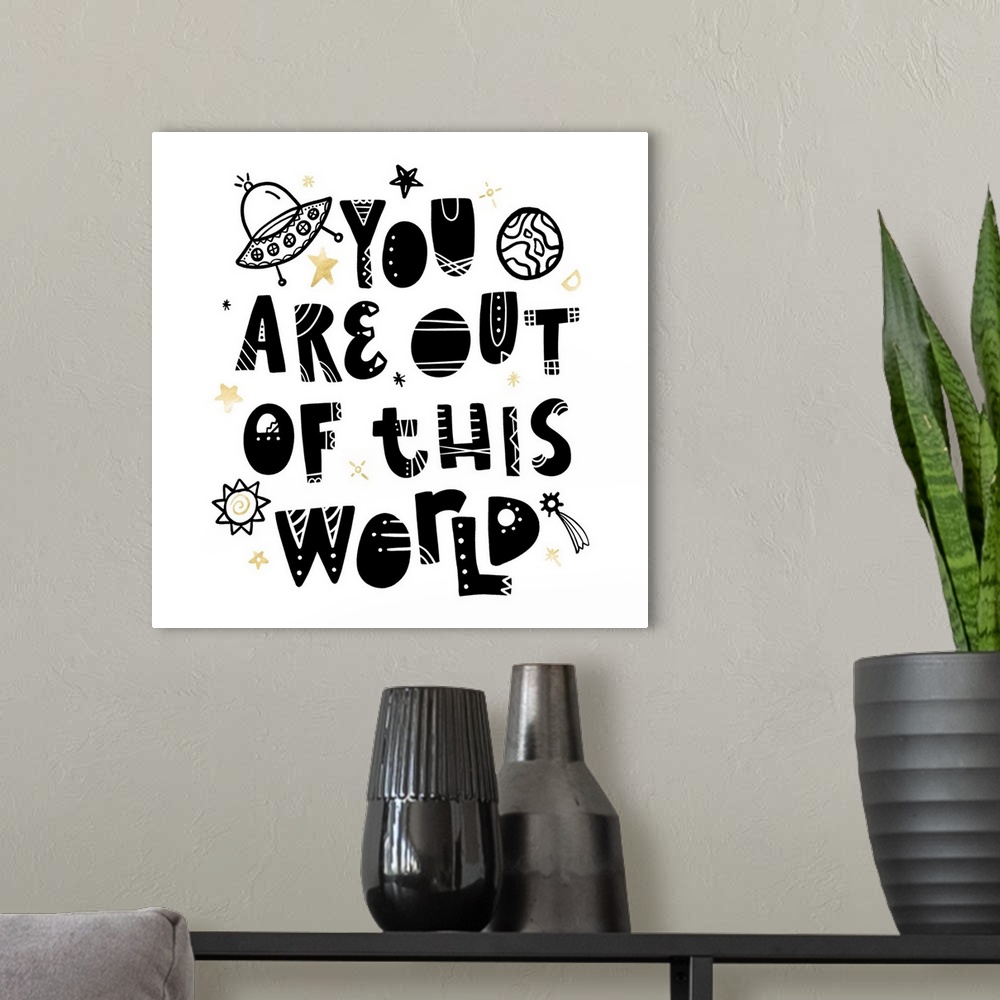 A modern room featuring "You Are Out Of This World" in an artistic font with stars and planets on a white background and ...