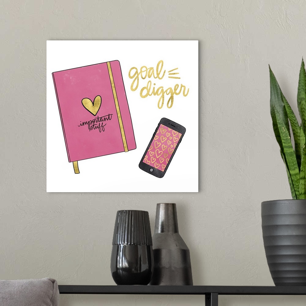 A modern room featuring A feminine decorative design of a planner and cell phone with "Goal Digger" in metallic gold.