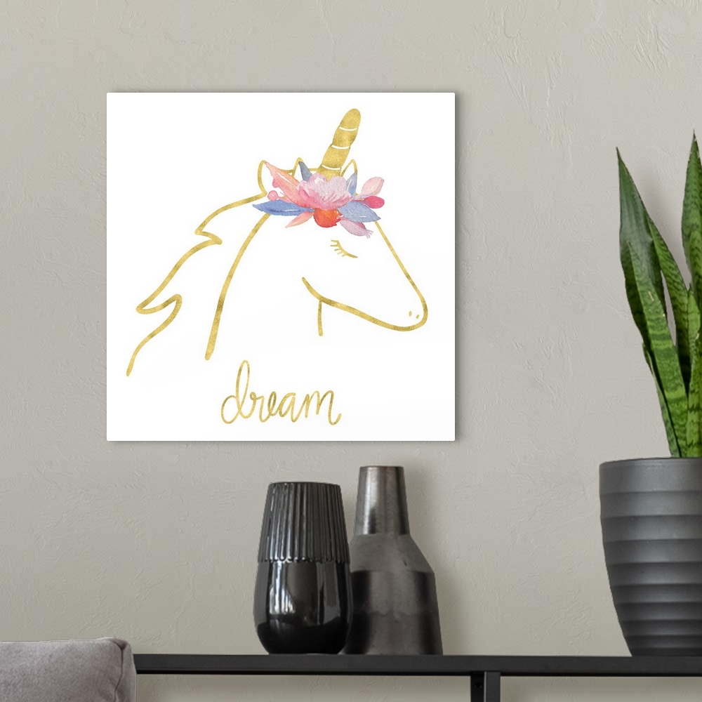 A modern room featuring "Dream" with a drawing of an unicorn in gold with colorful flowers on top of it's head.