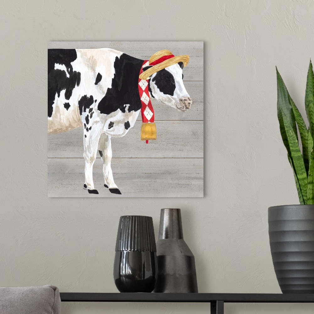 A modern room featuring A black and white cow with a straw hat and bell around her neck against of grey wood background.