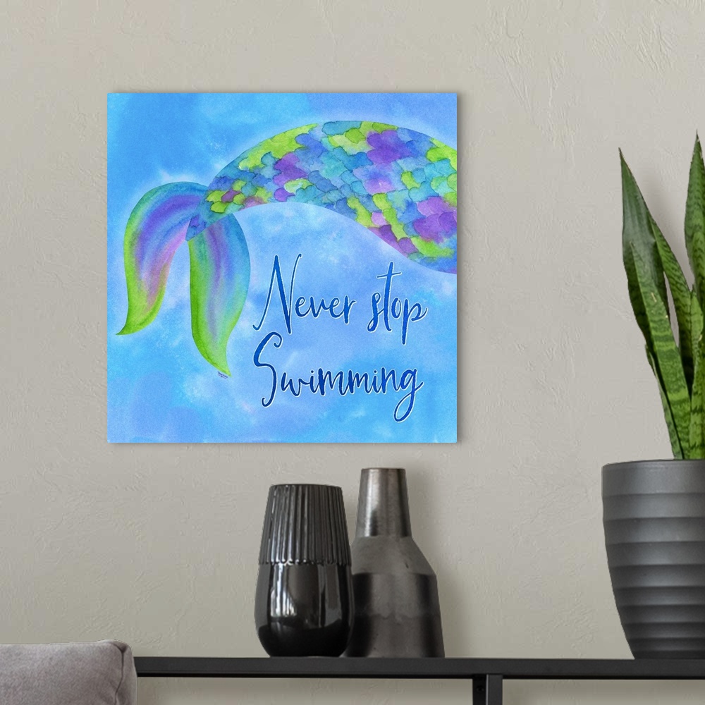 A modern room featuring "Never Stop Swimming" with a multi-colored mermaid tail on a blue background.