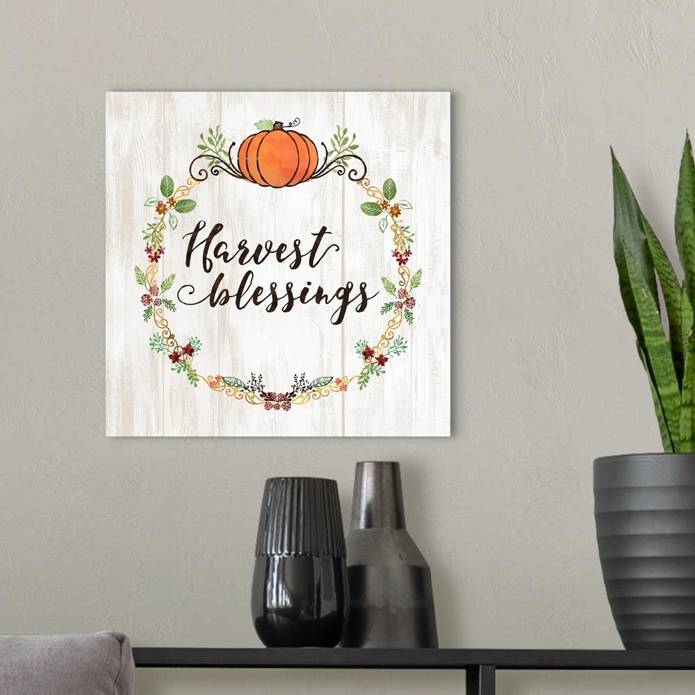 A modern room featuring "Harvest Blessings" with a seasonal wreath and pumpkin on a white wood backdrop.