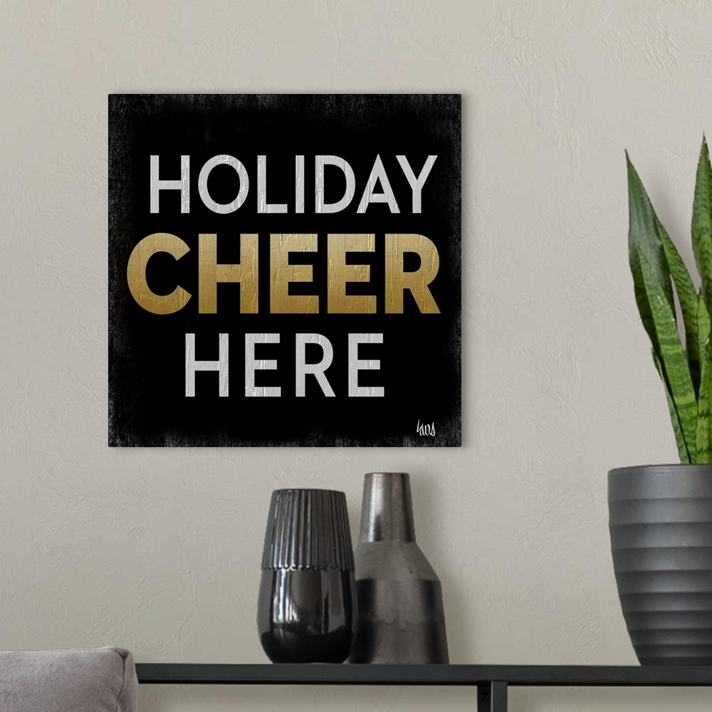 A modern room featuring "Holiday Cheer Here" on a black background with roughen edges.