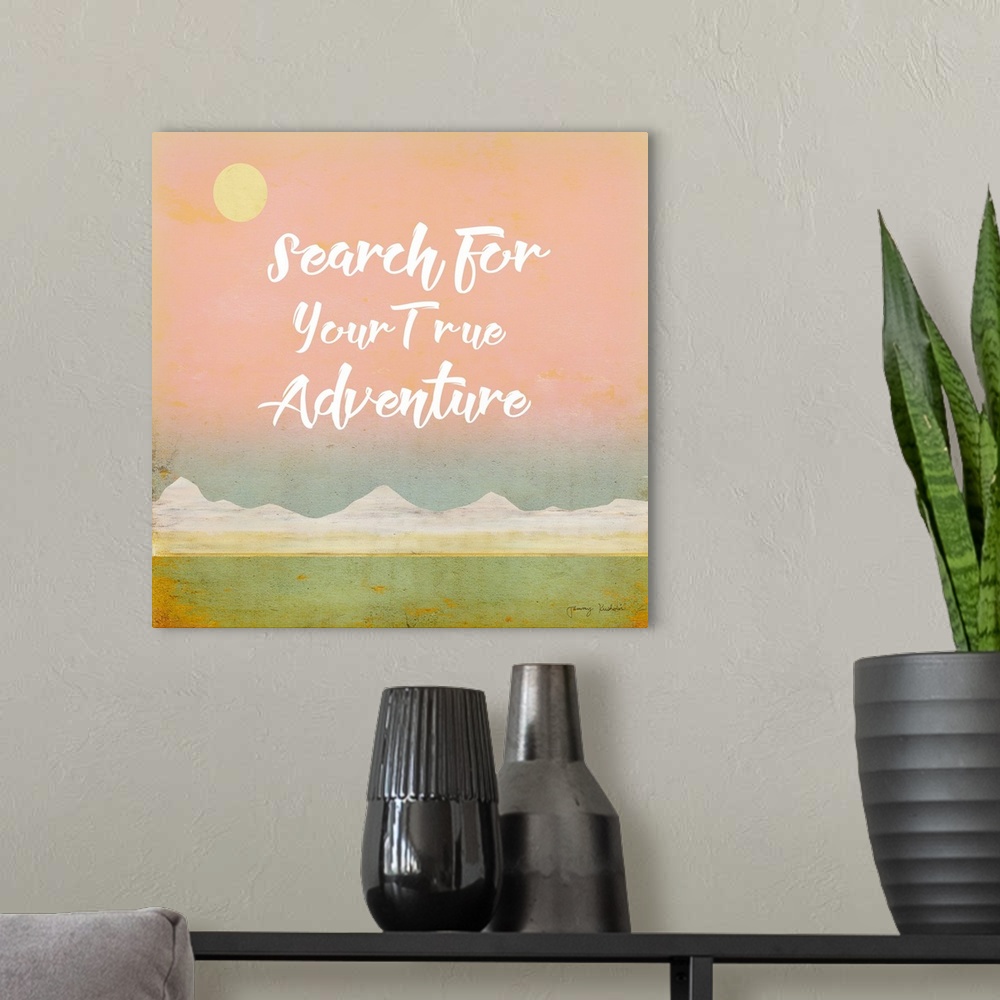 A modern room featuring "Search For Your True Adventure" in white with a mountain landscape with a pink sky.