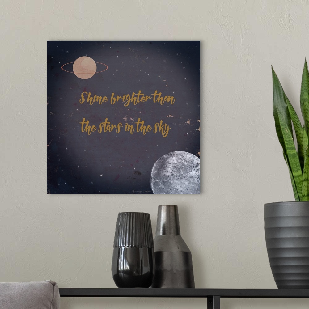 A modern room featuring "Shine Brighter Than The Stars In The Sky" in gold against an image of space.