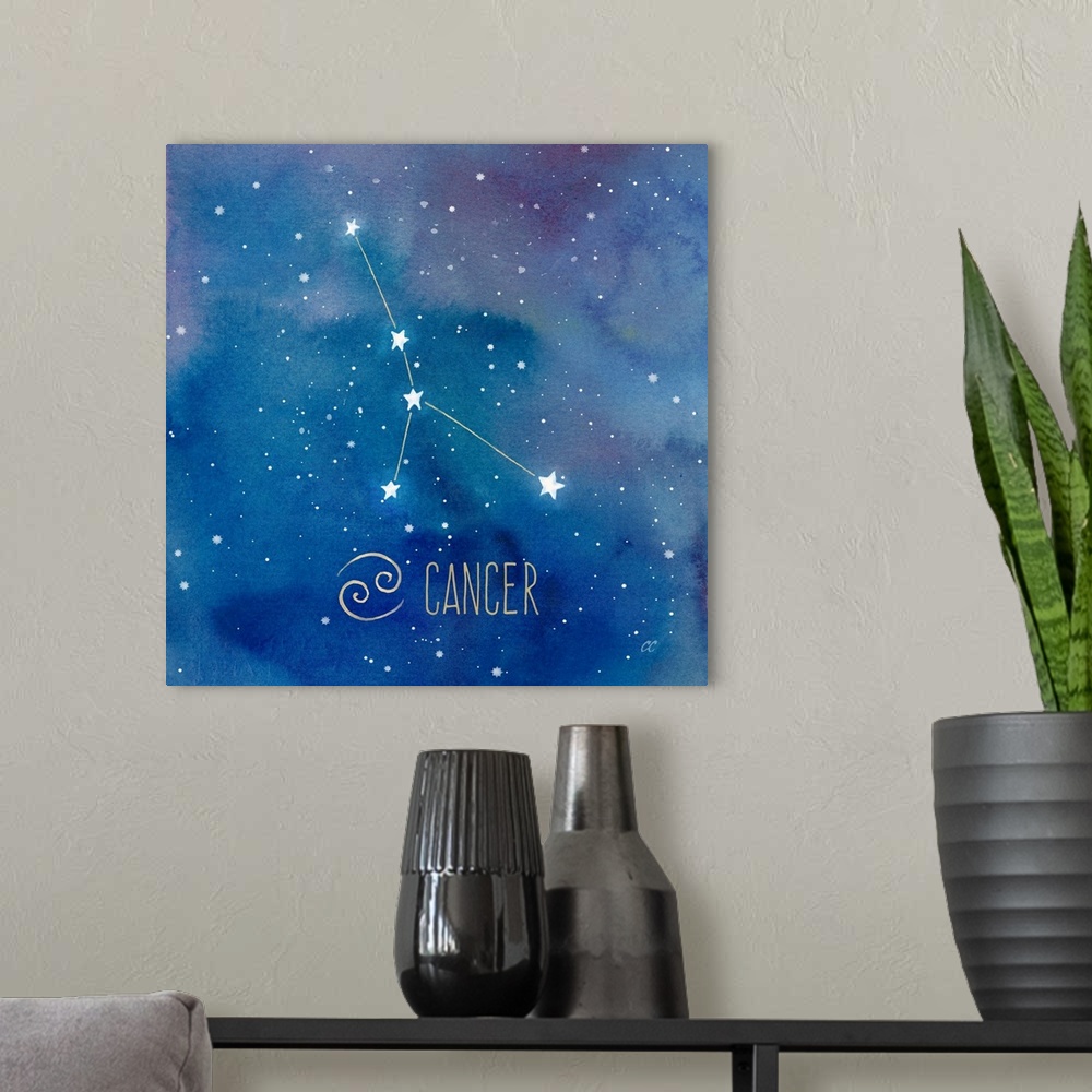 A modern room featuring Square artwork of the constellation of Cancer with the symbol.