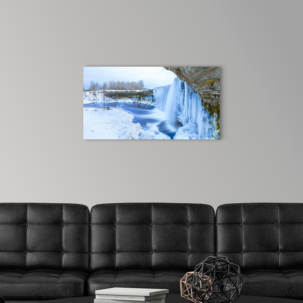 A modern room featuring Winter ice covered and snowy waterfall, Estonia