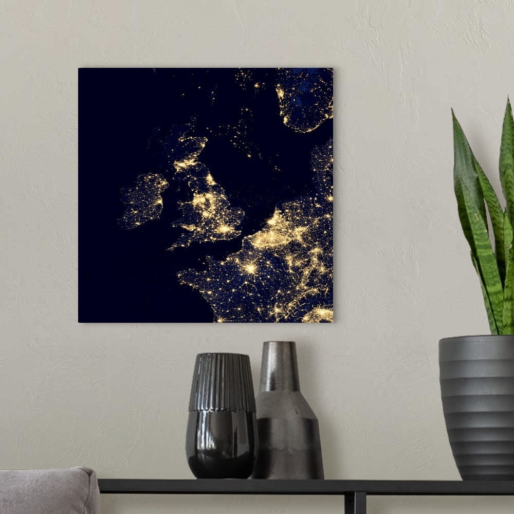 A modern room featuring North Sea at night. Black marble satellite image of the North Sea at night. Lights from ships and...