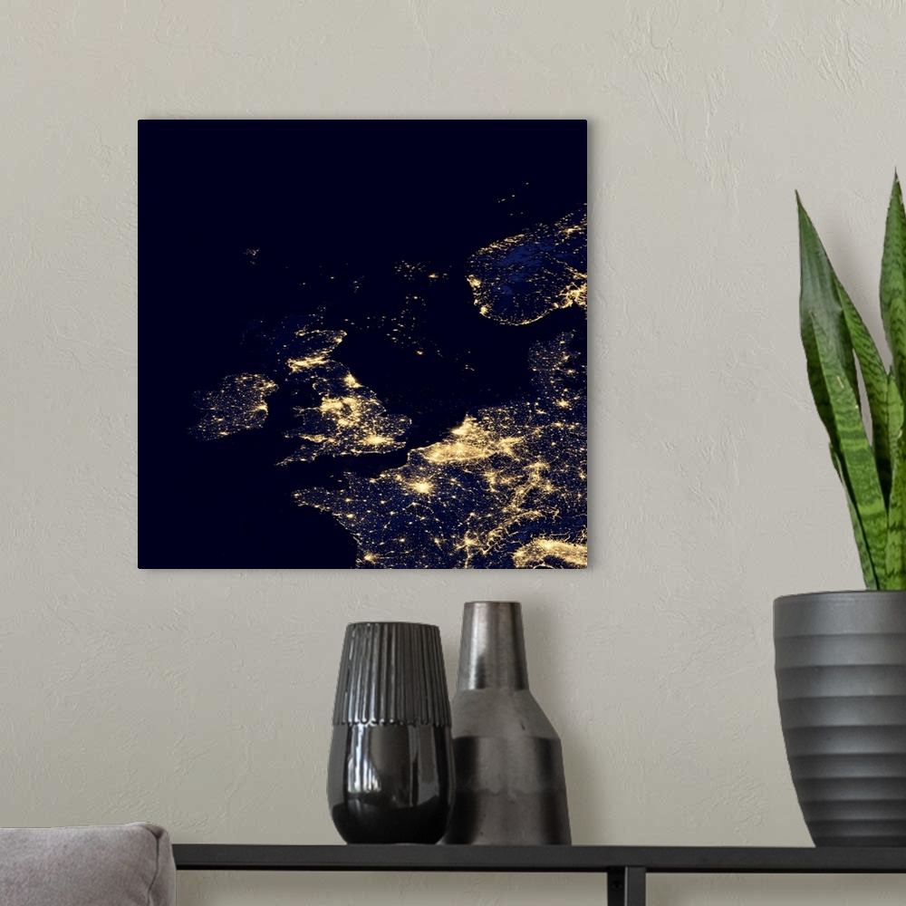 A modern room featuring North Sea at night. Black marble satellite image of the North Sea at night. Lights from ships and...
