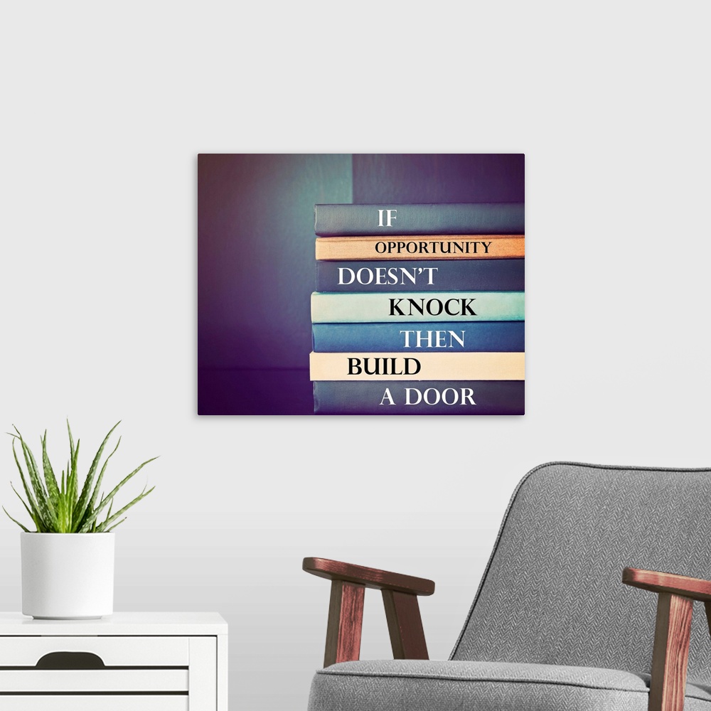 A modern room featuring an inspirational quote by unknown source on blue background with a stack of books