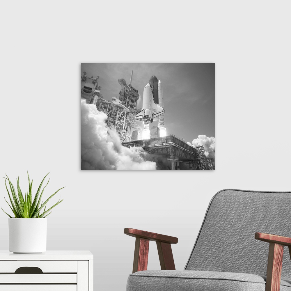 A modern room featuring American history photo of Space Shuttle Atlantis blasting off.