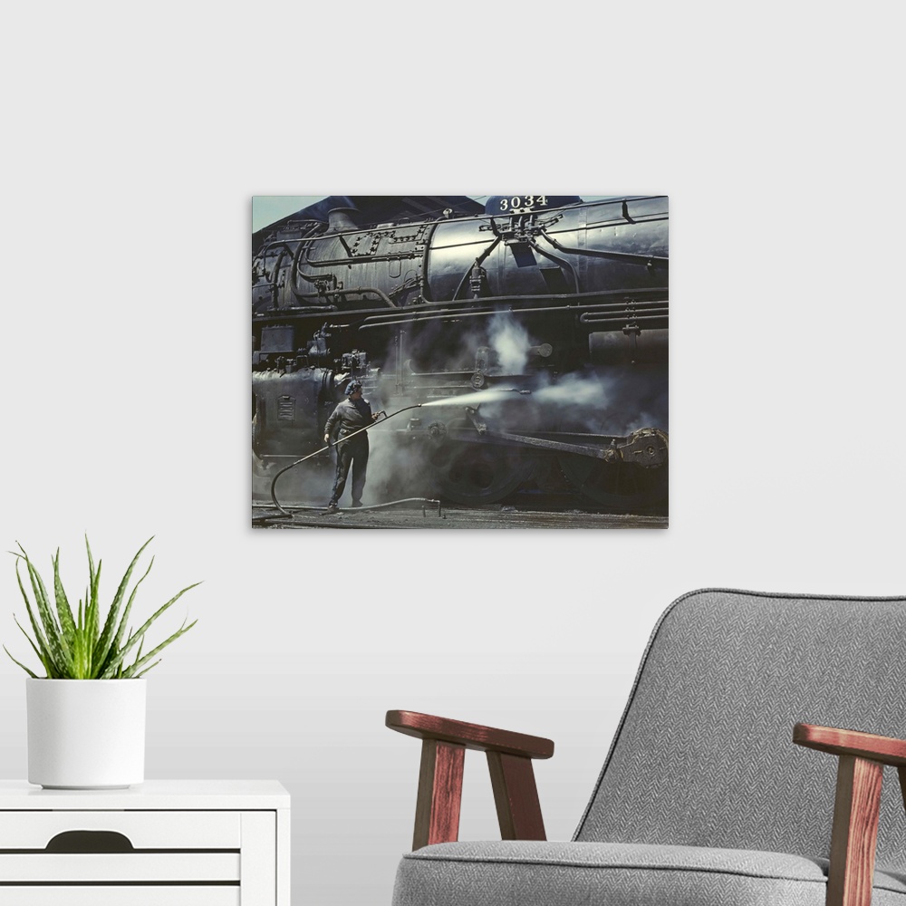 A modern room featuring American history photograph of a woman giving a Class H Locomotive a steam bath.