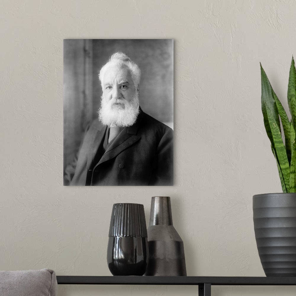 A modern room featuring American history photograph of Alexander Graham Bell, dated 1905.