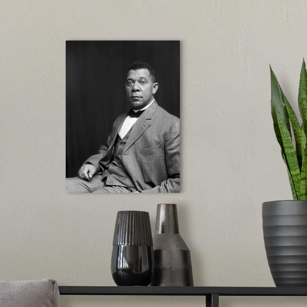 A modern room featuring American history portrait of Booker T. Washington, dated 1895.