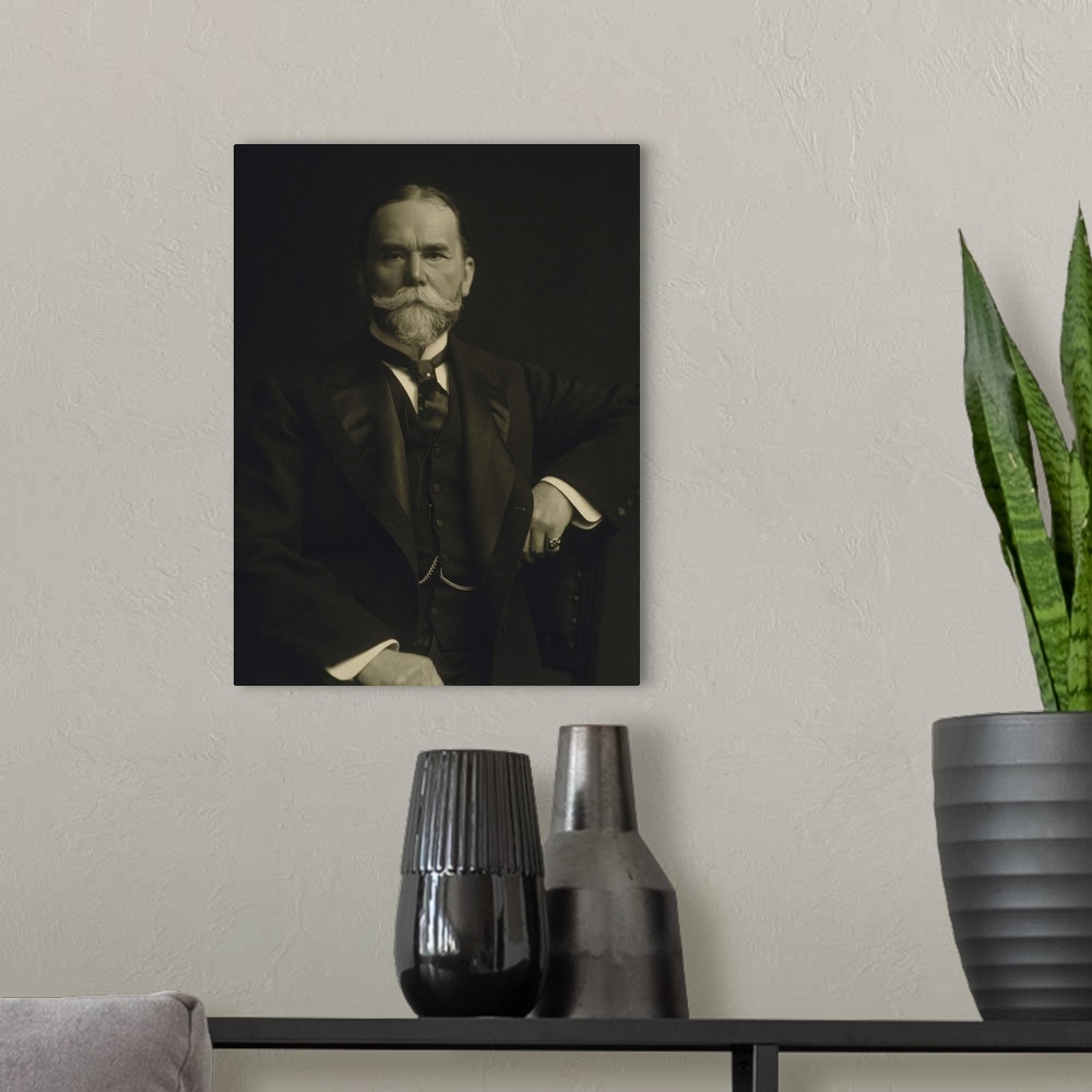 A modern room featuring American history portrait of John Hay.