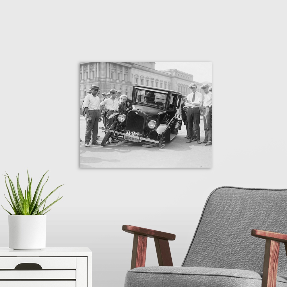 A modern room featuring American history photograph of a vintage car broken down in the street, Washington D.C., 1923.