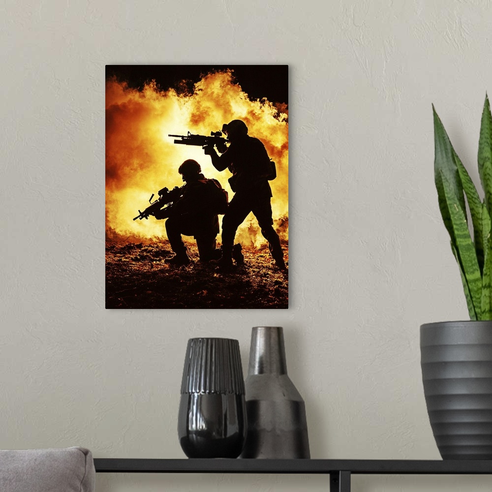 A modern room featuring Black silhouettes of a pair of soldiers in the burning fire  during a battle operation.