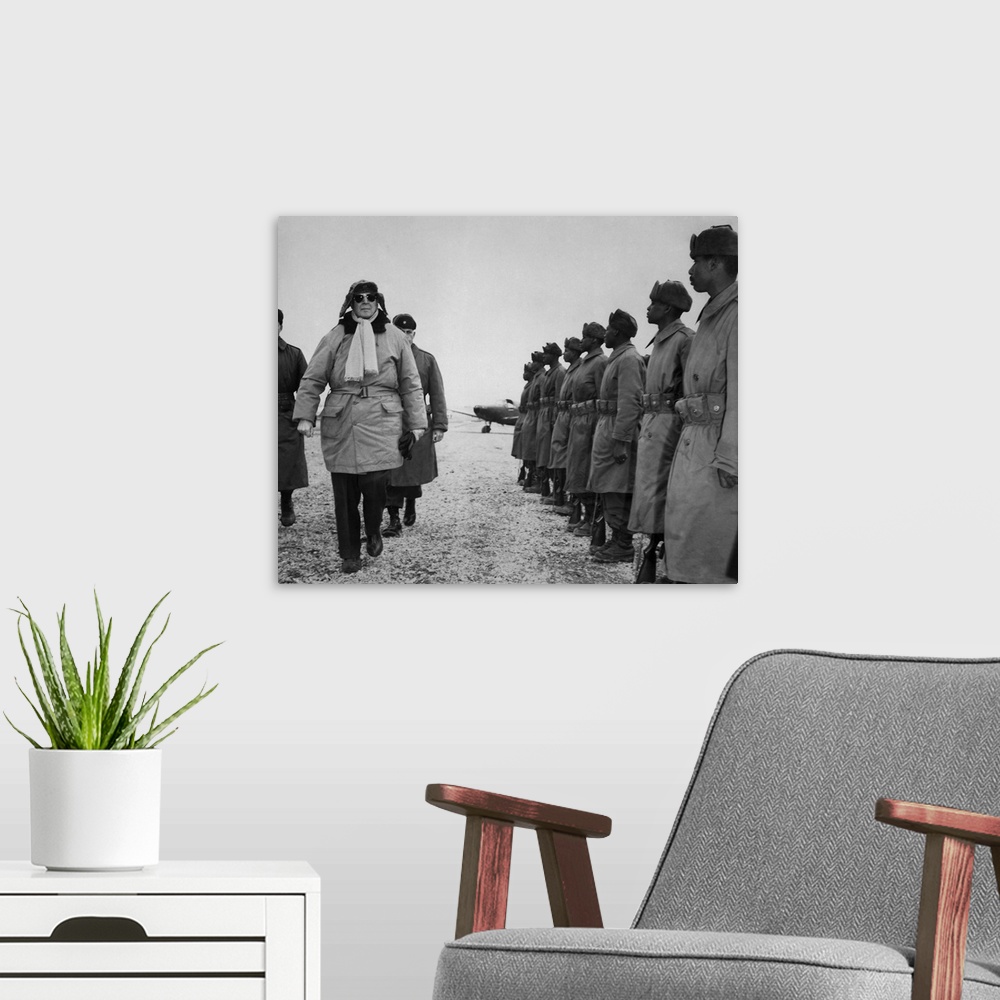 A modern room featuring General Douglas MacArthur inspecting troops of the 24th Infantry Division upon arrival at the Kim...