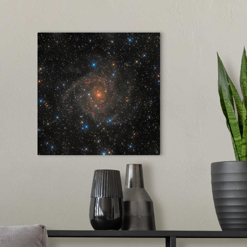 A modern room featuring Intermediate spiral galaxy IC 342.