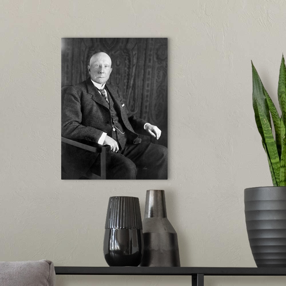 A modern room featuring Portrait of American business magnate John D. Rockefeller.