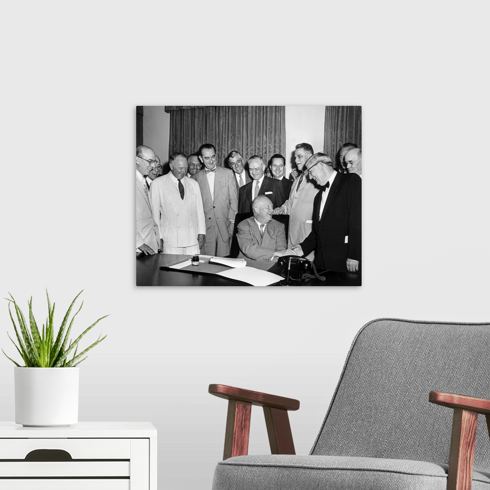 A modern room featuring President Eisenhower after a bill signing, June 21, 1955.