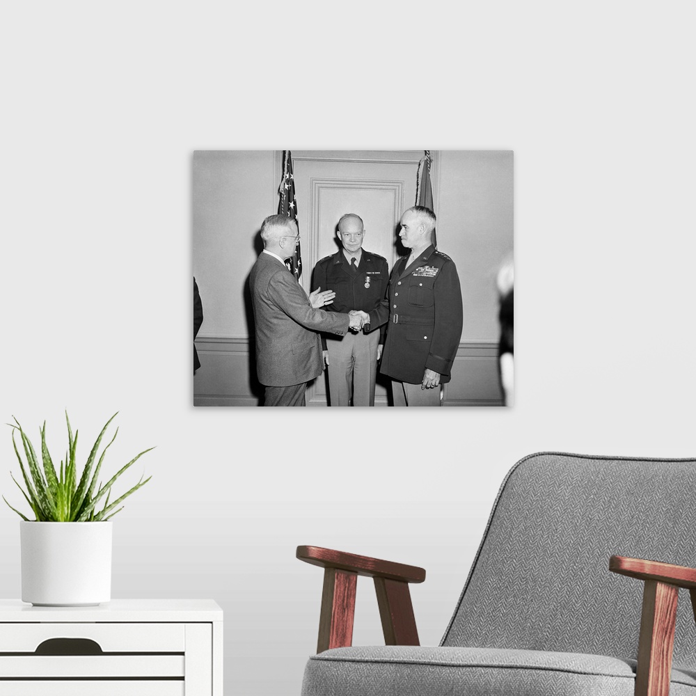 A modern room featuring President Harry Truman shaking hands with General Omar Bradley.