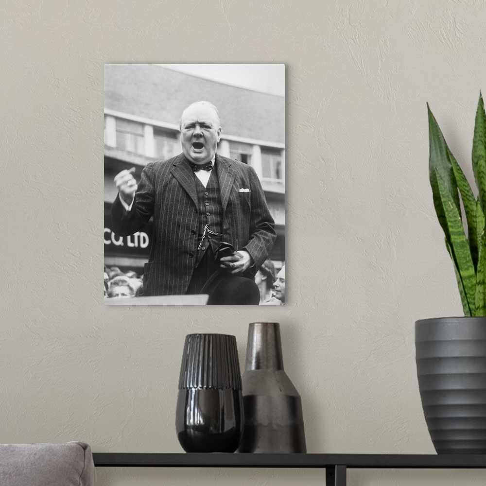 A modern room featuring British history photograph of Prime Minister Winston Churchill during an election campaign speech...