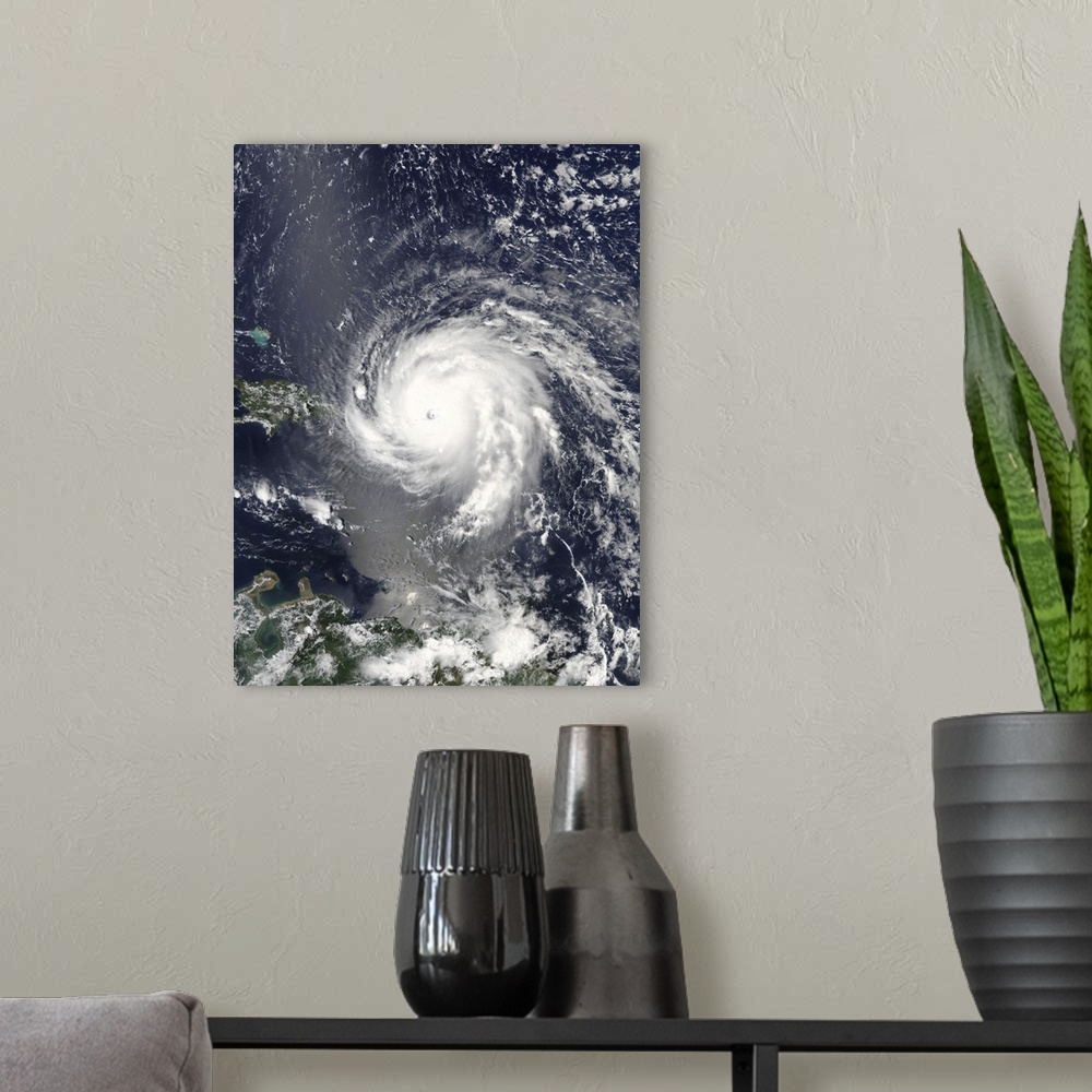 A modern room featuring Satellite view of Hurricane Irma over the Leeward Islands and Puerto Rico.
