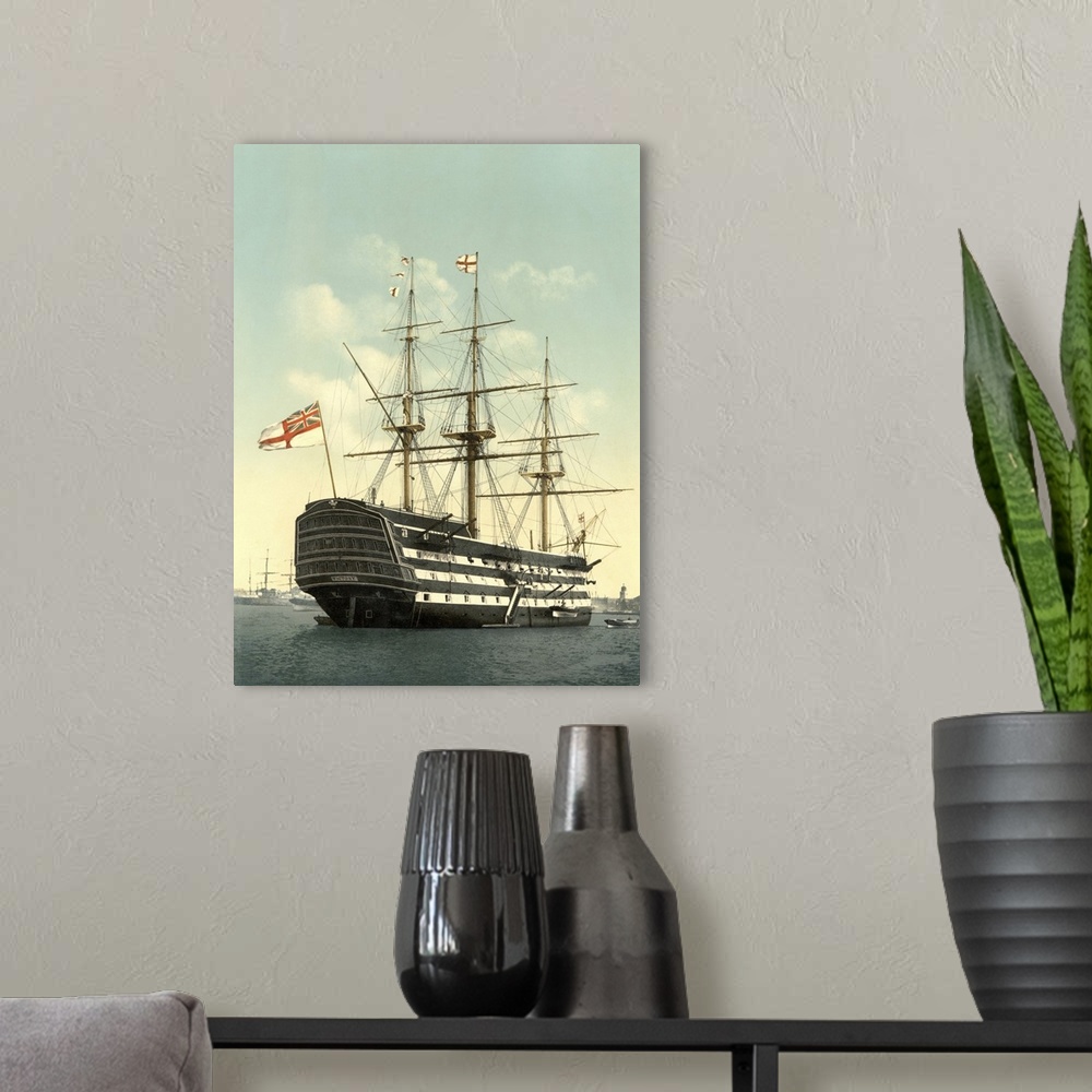 A modern room featuring Vintage maritime history print of the HMS Victory.
