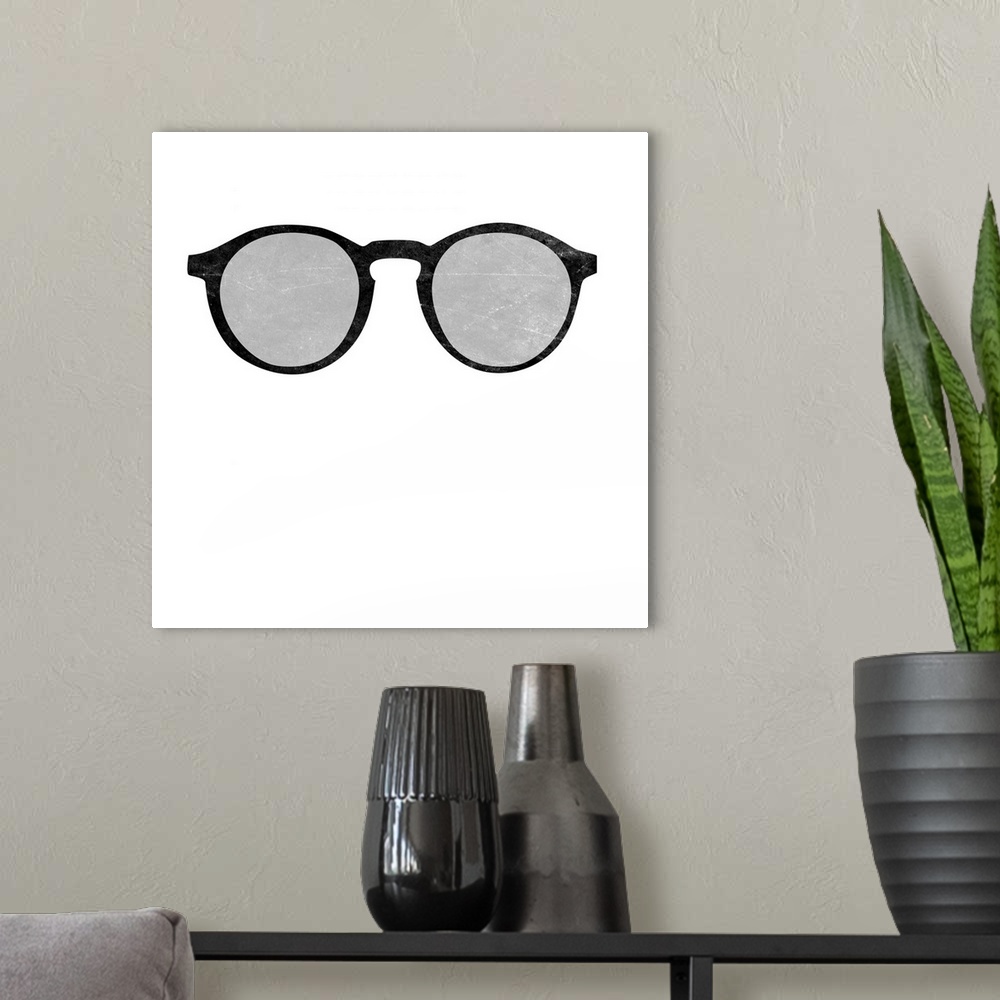 A modern room featuring A pair of black and gray glasses on a solid white background.