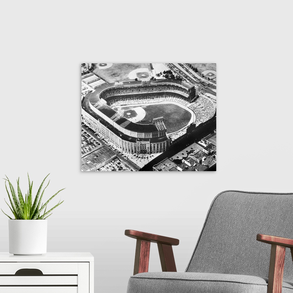A modern room featuring Aerial view of Yankee Stadium in the Bronx, New York City. Photograph, c1955.