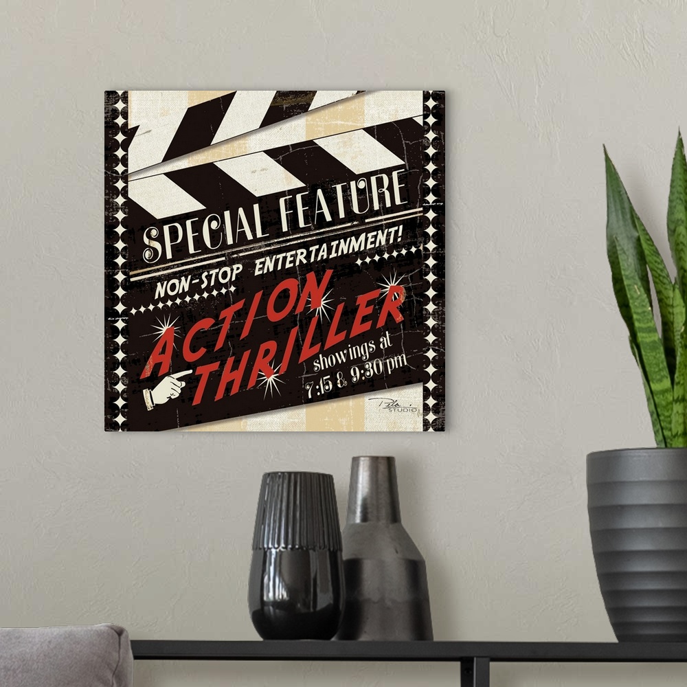 A modern room featuring Contemporary artwork of a film makers clap-board, with bright red text on the front of it.