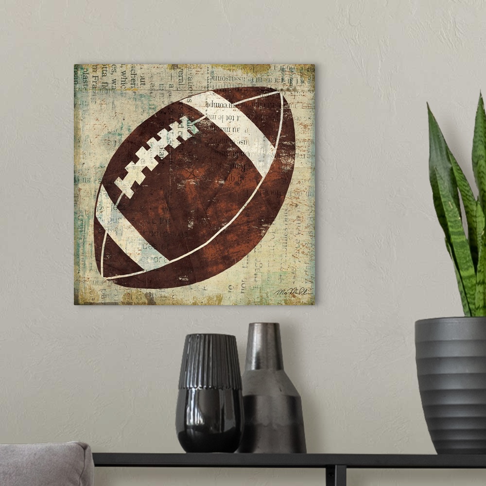 A modern room featuring Home decor wall art that is square in shape. This artwork is a simplified American football paint...