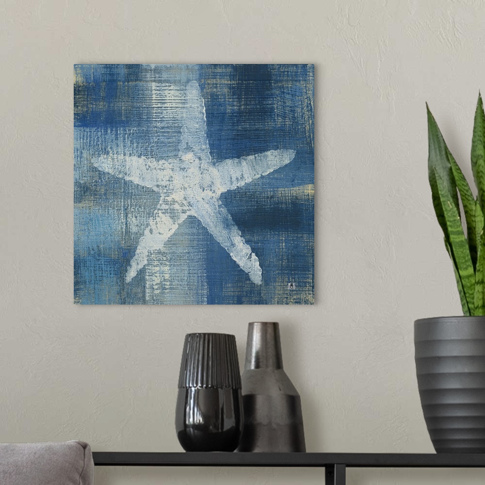 A modern room featuring Square artwork of a white starfish among a white and blue brushed finish.