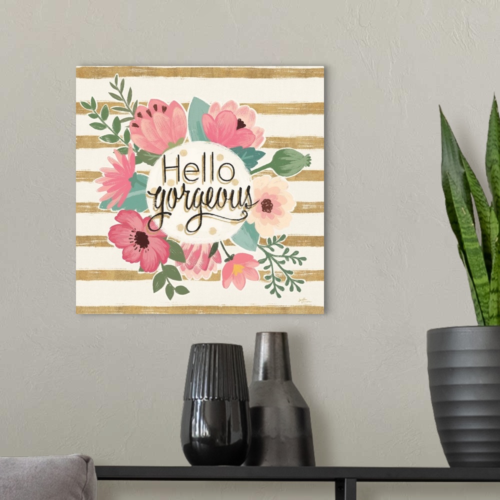 A modern room featuring "Hello Gorgeous" surrounded by pink flowers on a gold and cream striped background.