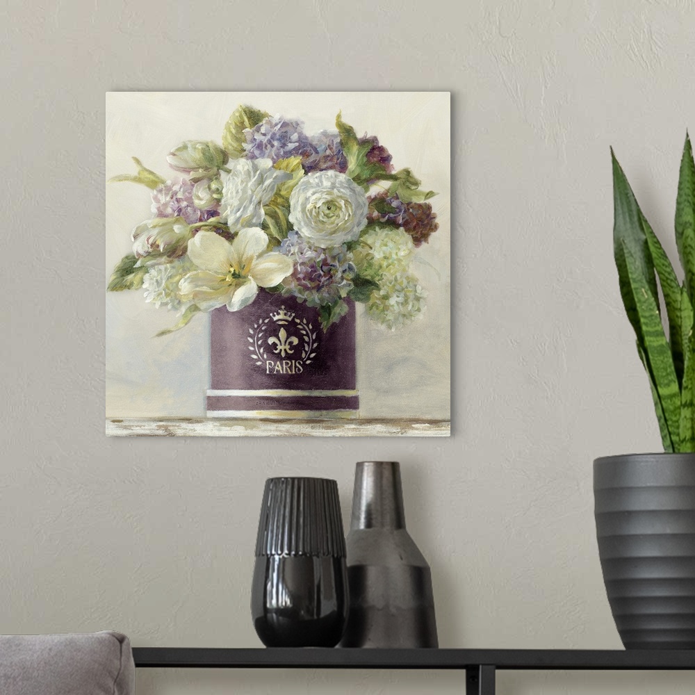 A modern room featuring Still life painting of a hatbox filled with a variety of flowers against a soft background.