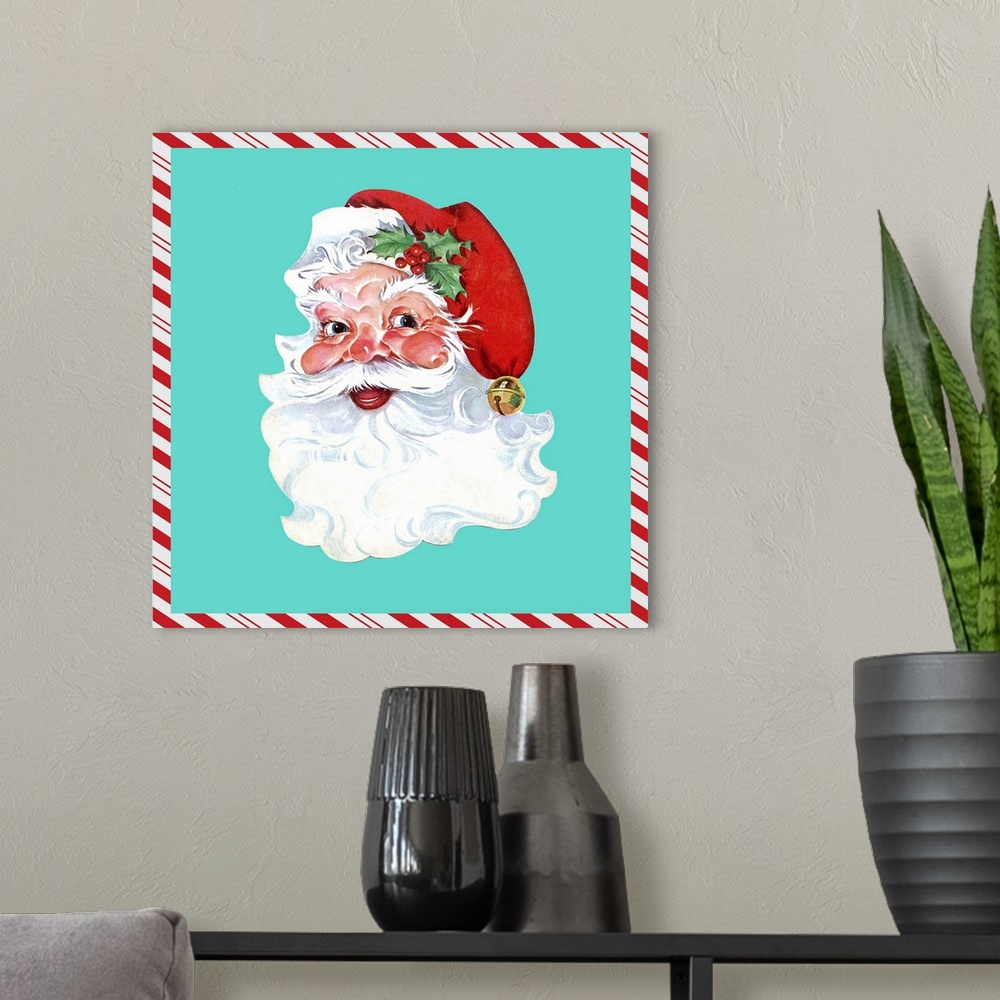 A modern room featuring Square vintage artwork of a smiling Santa on a teal background bordered with a candy cane pattern.