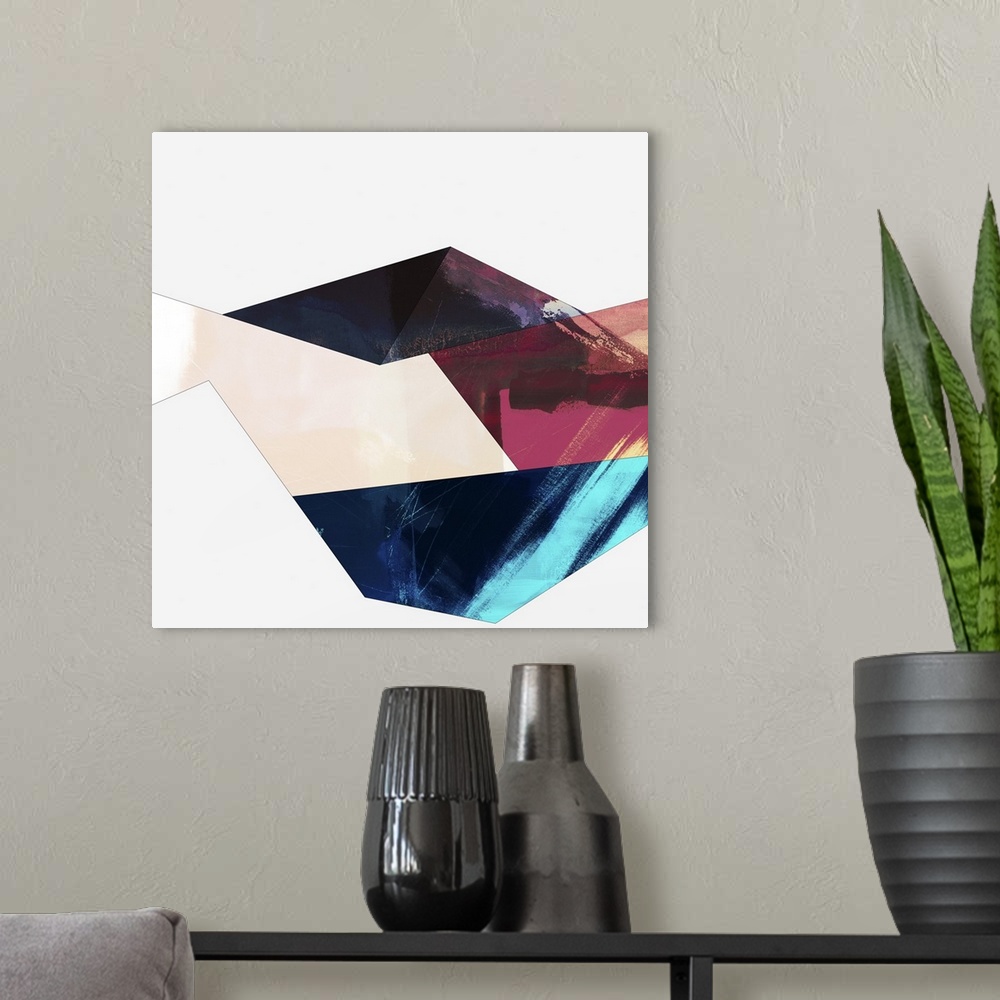 A modern room featuring Modern abstract artwork of angular shapes in brown, red, and teal.