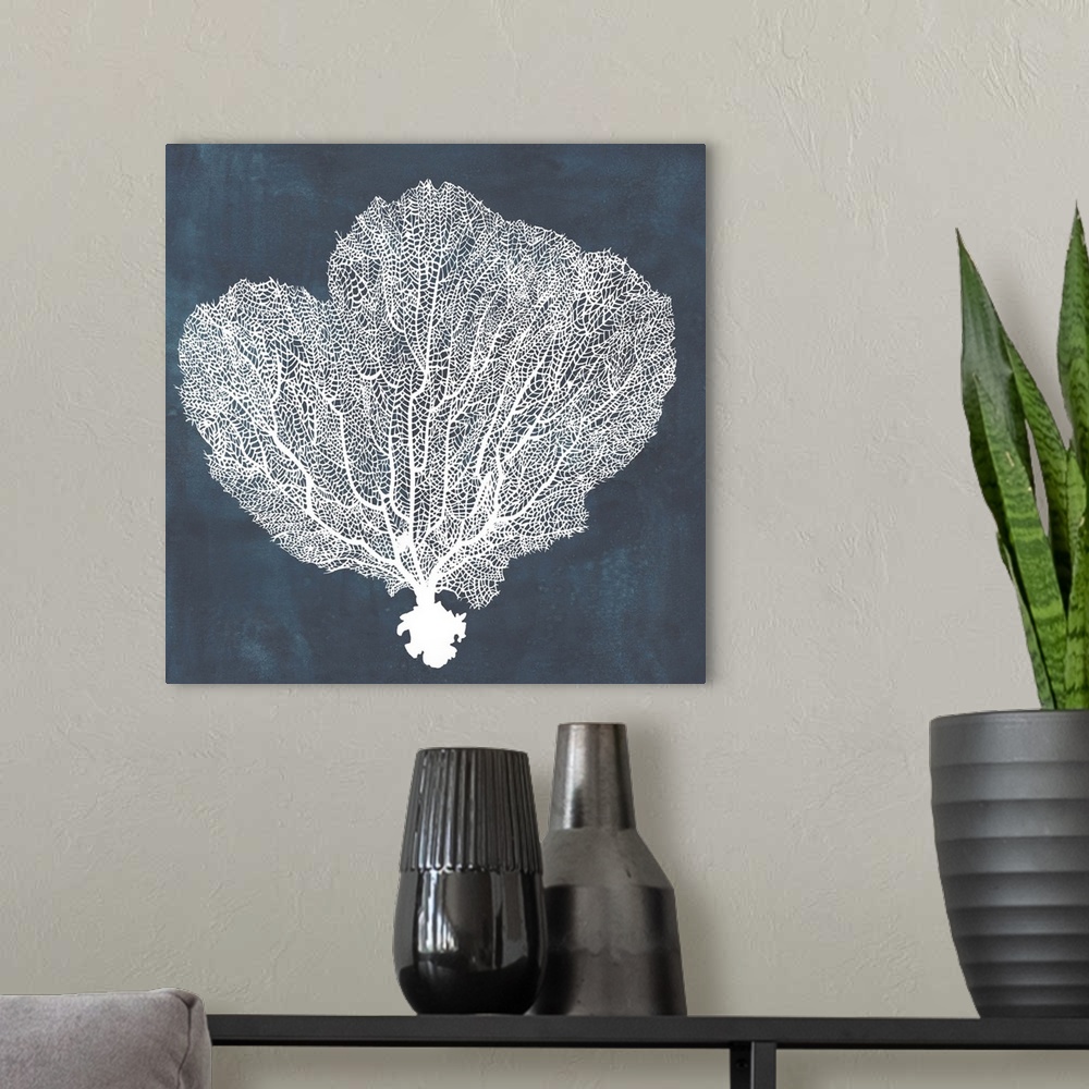 A modern room featuring Contemporary nautical themed artwork of a sea fan in white against a dark navy blue background.