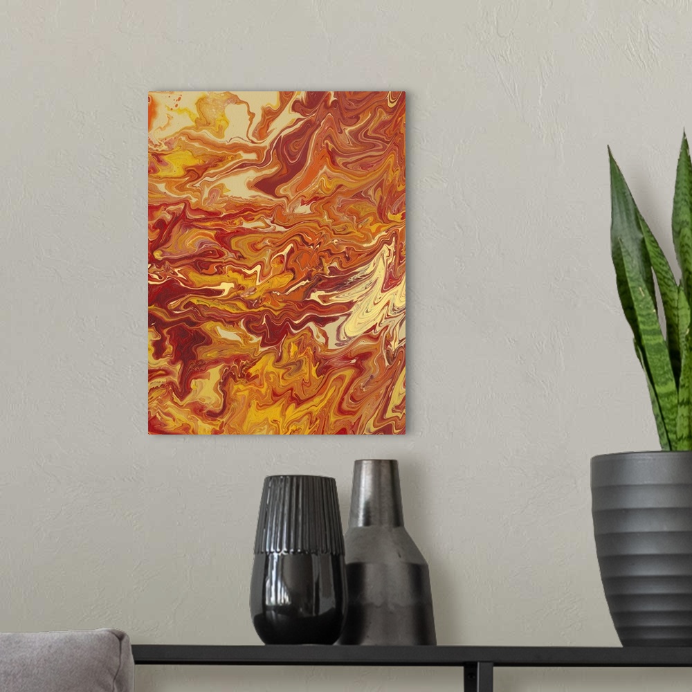 A modern room featuring Abstract artwork of yellow, orange and red shades in a liquid marble effect.