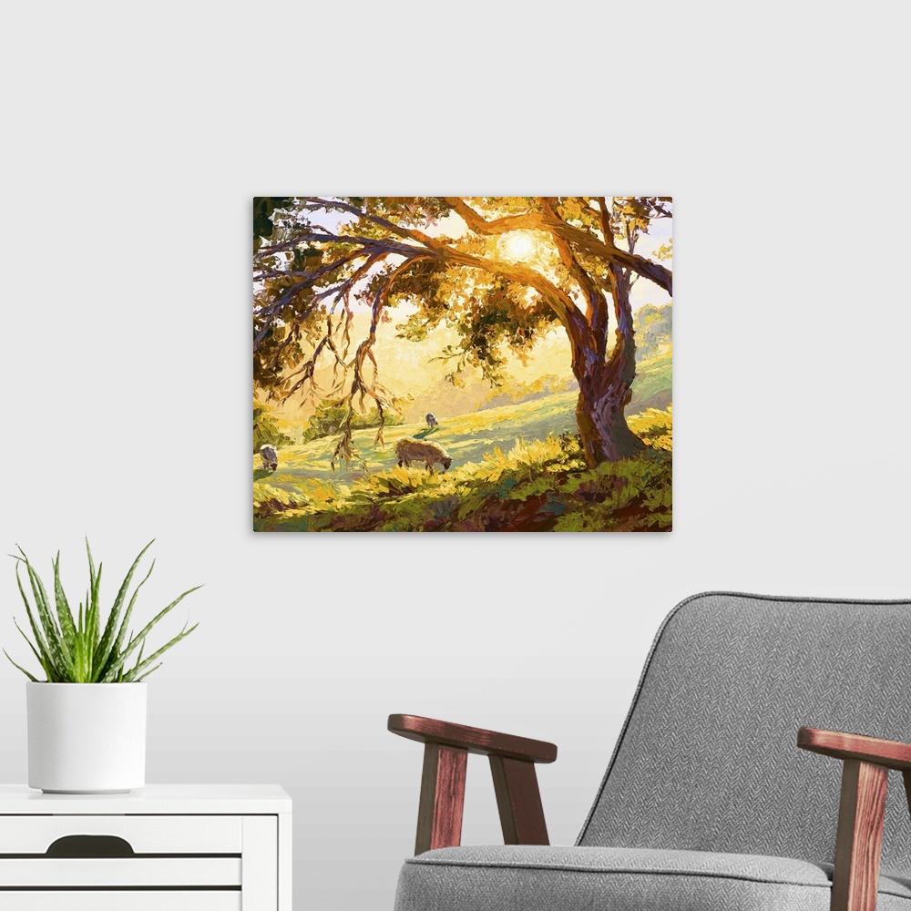 A modern room featuring Contemporary artwork of a countryside field in the light of early morning while animals graze.